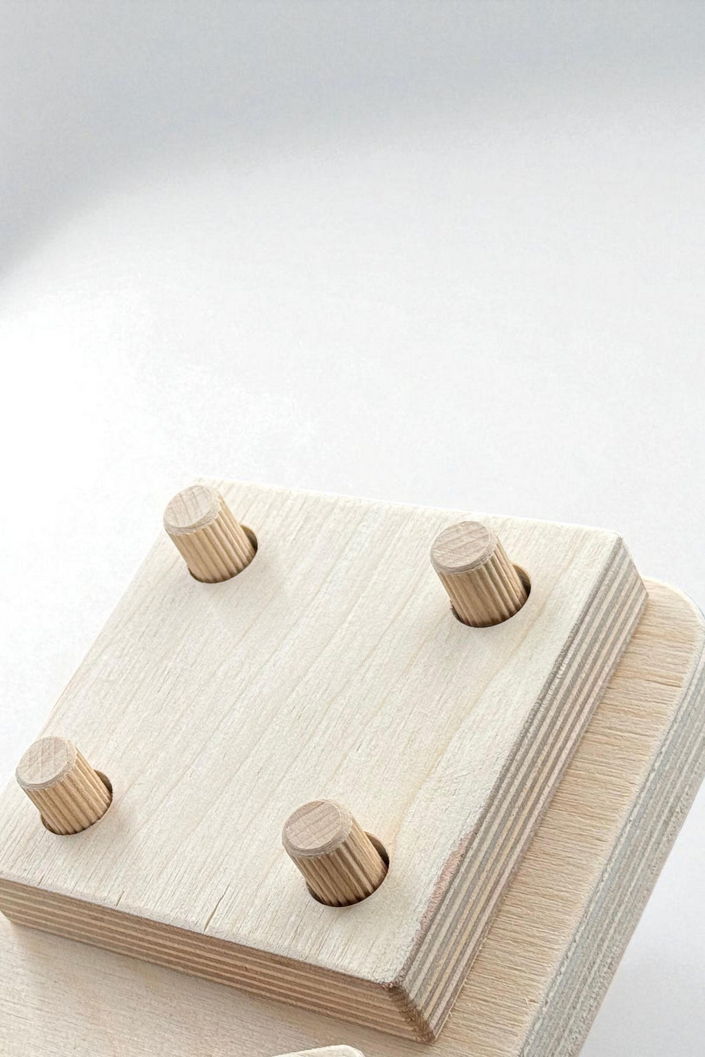 4-Piece Wooden Geometry Puzzle Board | Montessori-Style Shape Toy for Kids - front view of the wooden activity toy