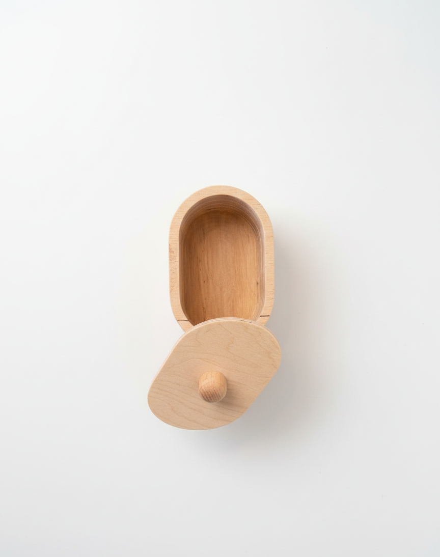 Large Ellipse Wooden Box Puzzle Toy for Kids | Natural Wood Activity Toy, Compact Montessori-Style Shape Puzzle, Nursery Shelf Decor Accent - front view of the wooden activity toy