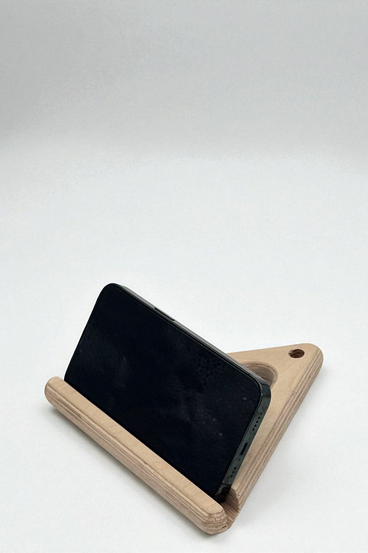 Wooden Triangle Phone and Tablet Holder, Compact Stand for Desk or Nightstand - front view of the product