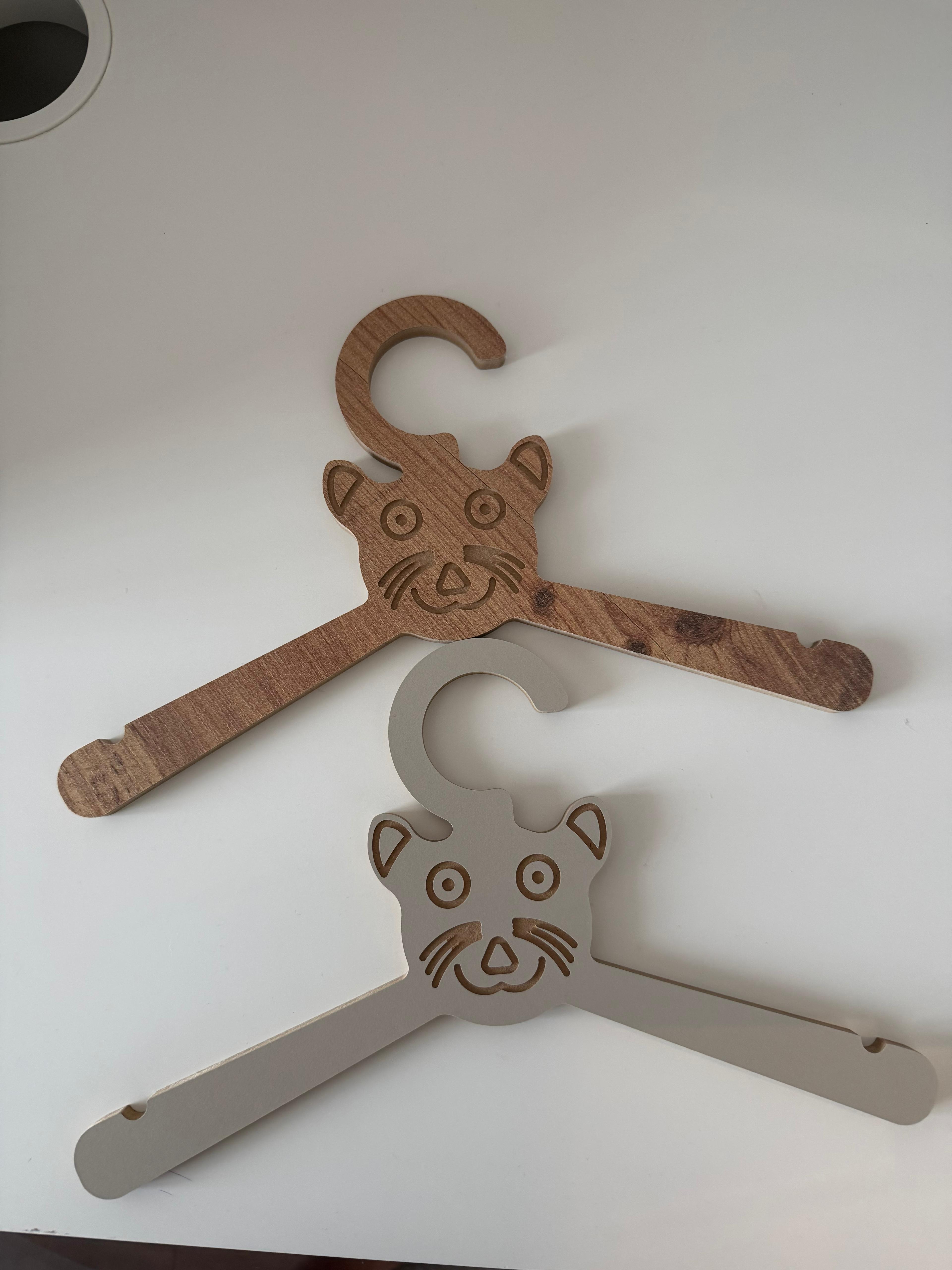 Set of 6 Brown Wooden Kids Coat Hangers, Child-Size Clothes Hangers for Nursery and Closet Organization - close up of the product detail